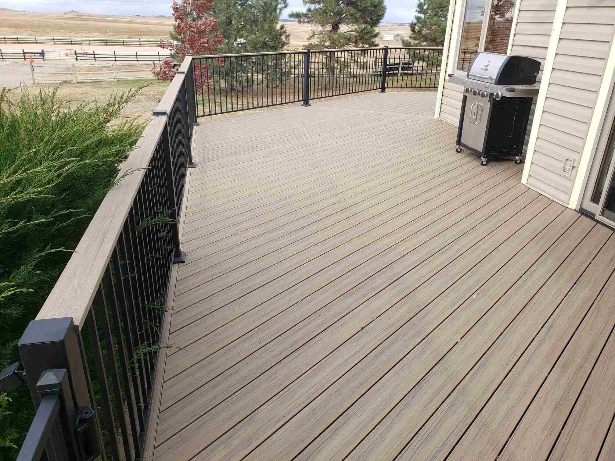 photo of a composite deck with deck railing - Composite decking materials and contractors in Colorado