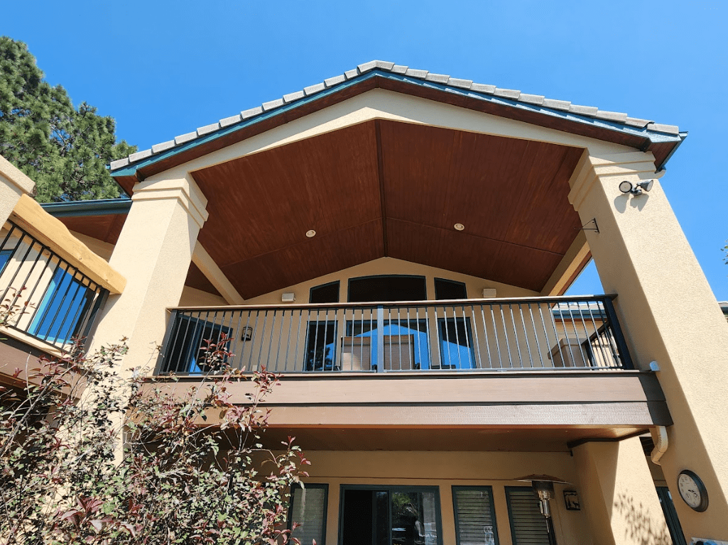 photo of an elevated deck with deck lighting - Outdoor living features contractors in Colorado