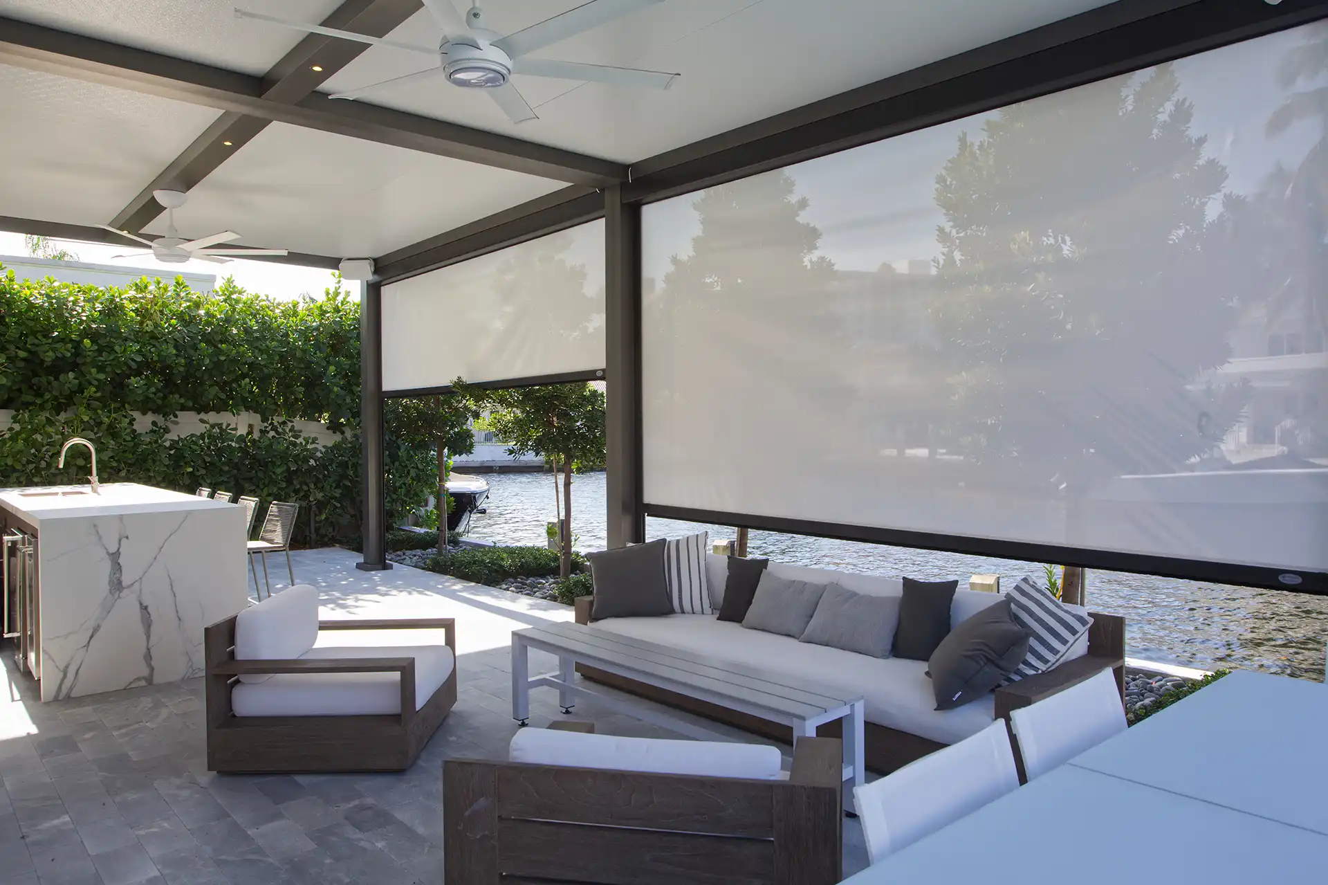 photo of an Azenco R-Shade pergola with privacy screens to create a privacy room