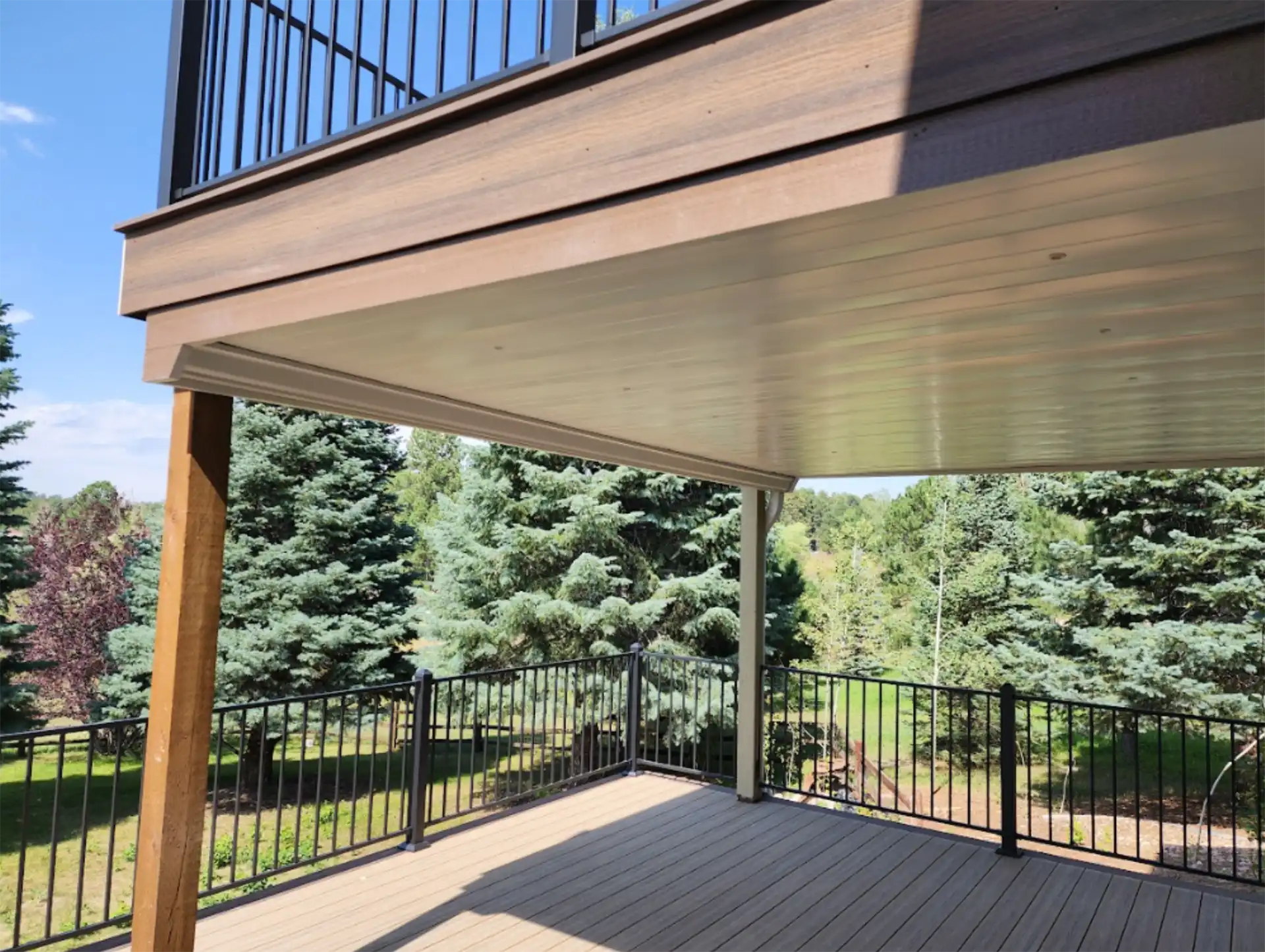 photo of a multi-level deck with an under deck waterproofing system featuring a finished deck ceiling