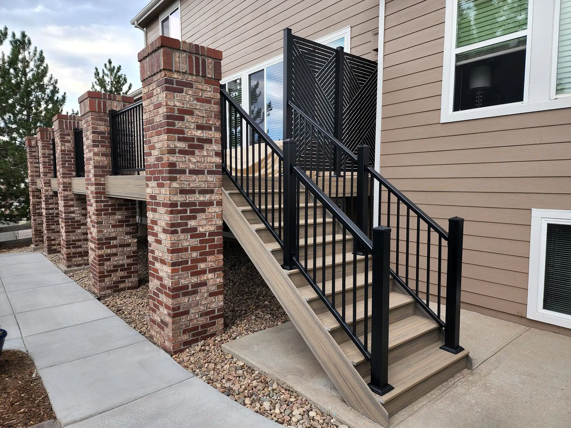 raised deck with a balcony deck and patio underneath - Composite-Deck-Builders-in-Douglas County-CO