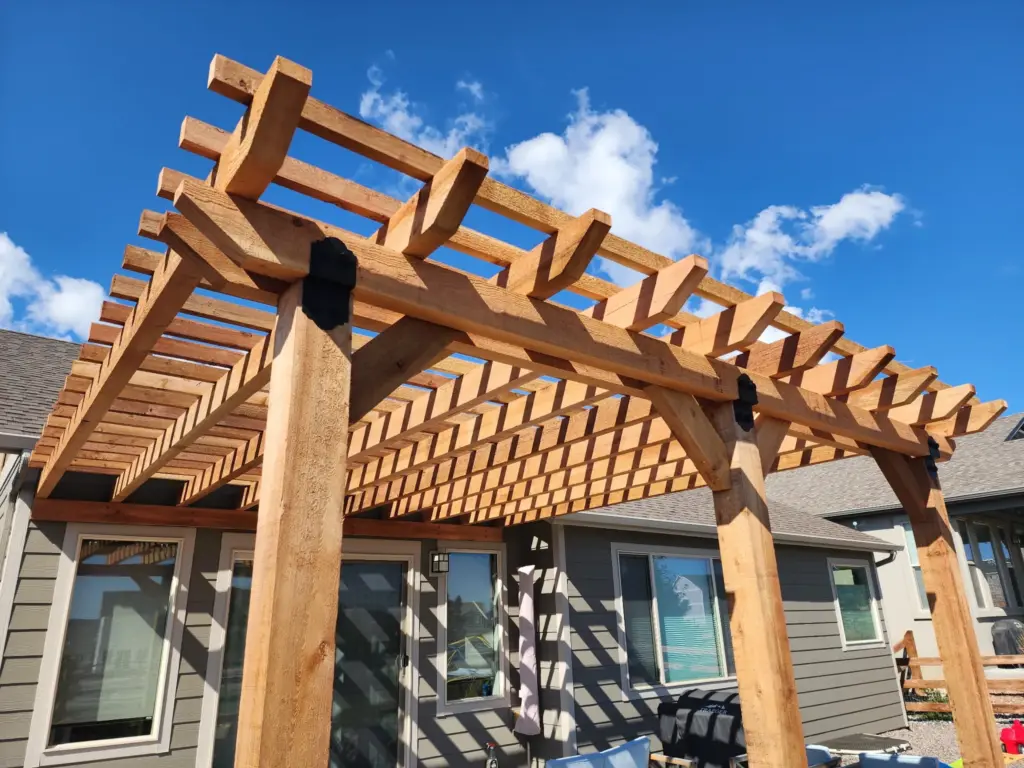 cedar-pergola-attached-on-the-gray-modern-house-with-multiple-windows-and-outdoor-living-space-in-castle-rock-co