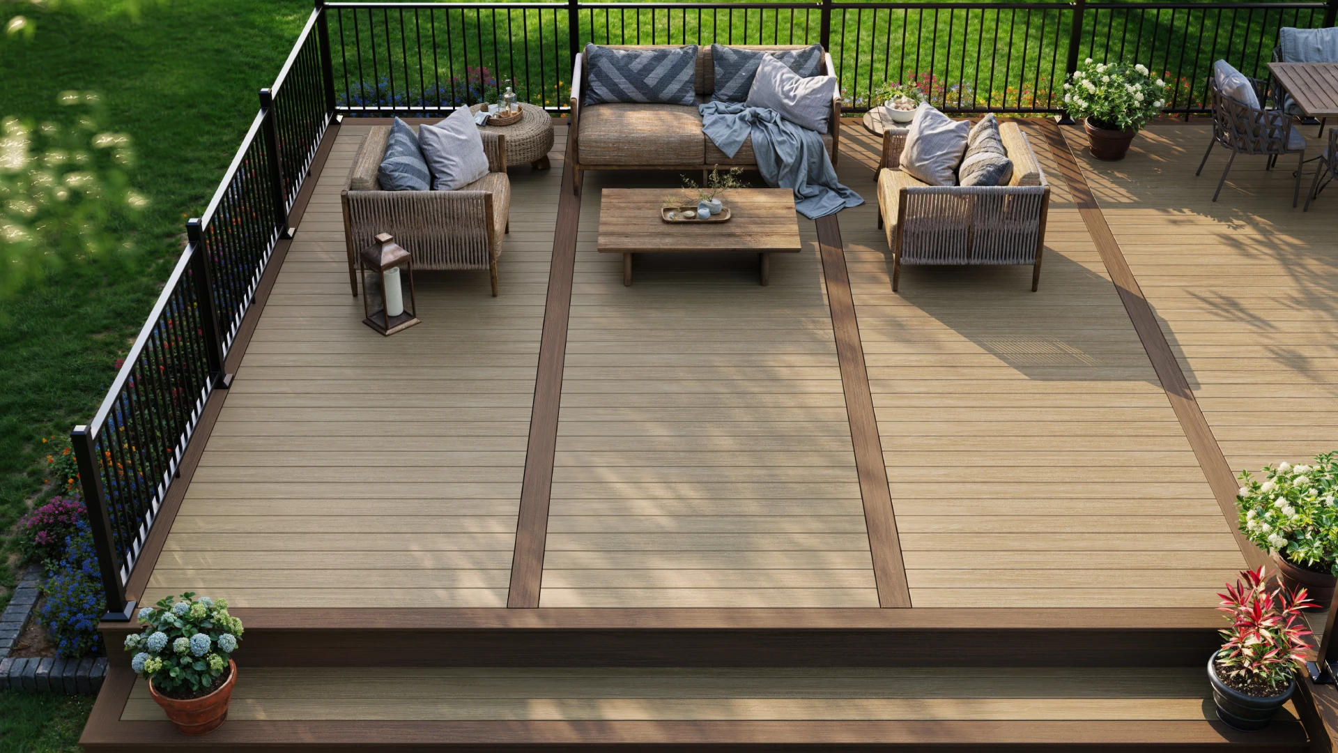 composite-deck-with-black-metal-railing-and-outdoor-living-sofa-and-dining-set-area-with-decorative-potted-plants-in-castle-rock-co