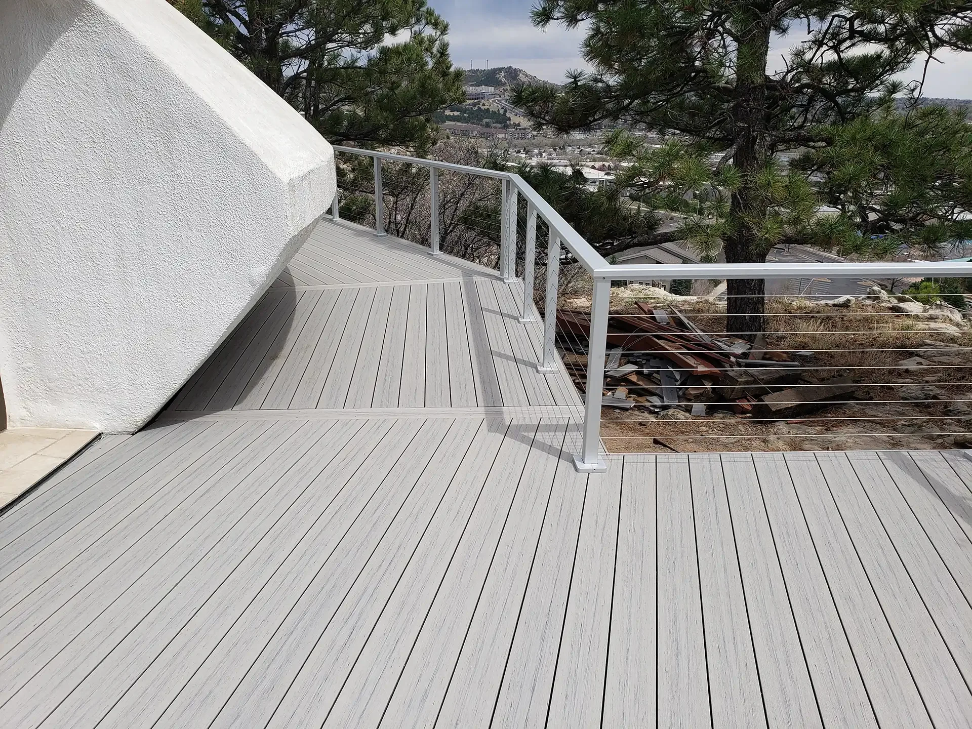 custom-commercial-deck-with-cable-railing-featuring-city-view-on-the-background-in-castle-rock-co