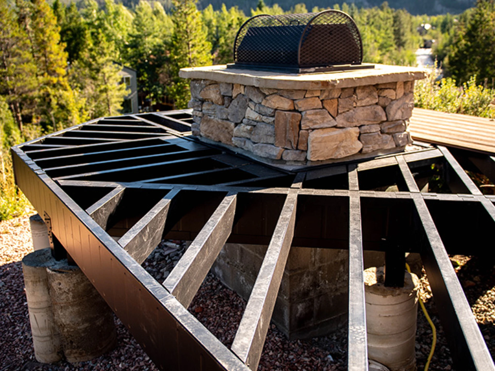 evolution-steel-deck-framing-on-the-brick-pillar-with-trees-on-the-background-in-castle-rock-co