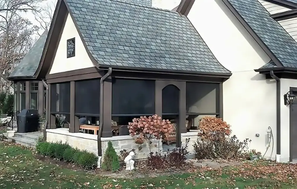 house-with-a-screened-in-porch-featuring-a-statue-in-the-yard-surrounded-by-grass-in-castle-rock-co