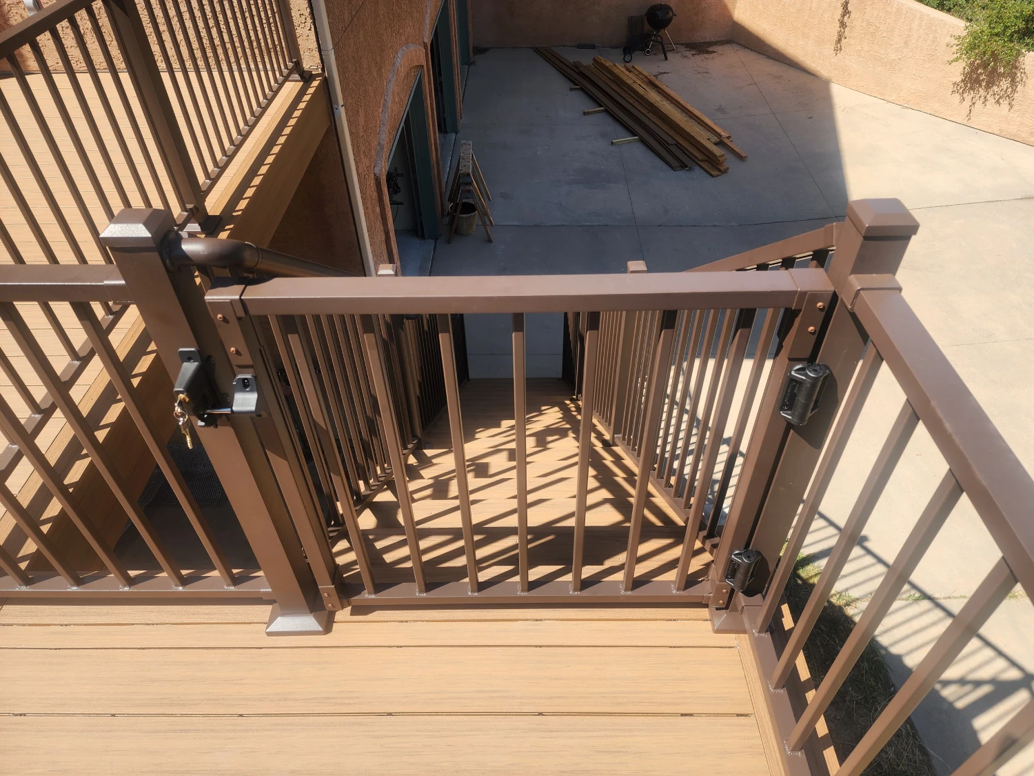 pvc-deck-with-brown-deck-railing-installation-with-a-gate-and-staircase-in-castle-rock-co