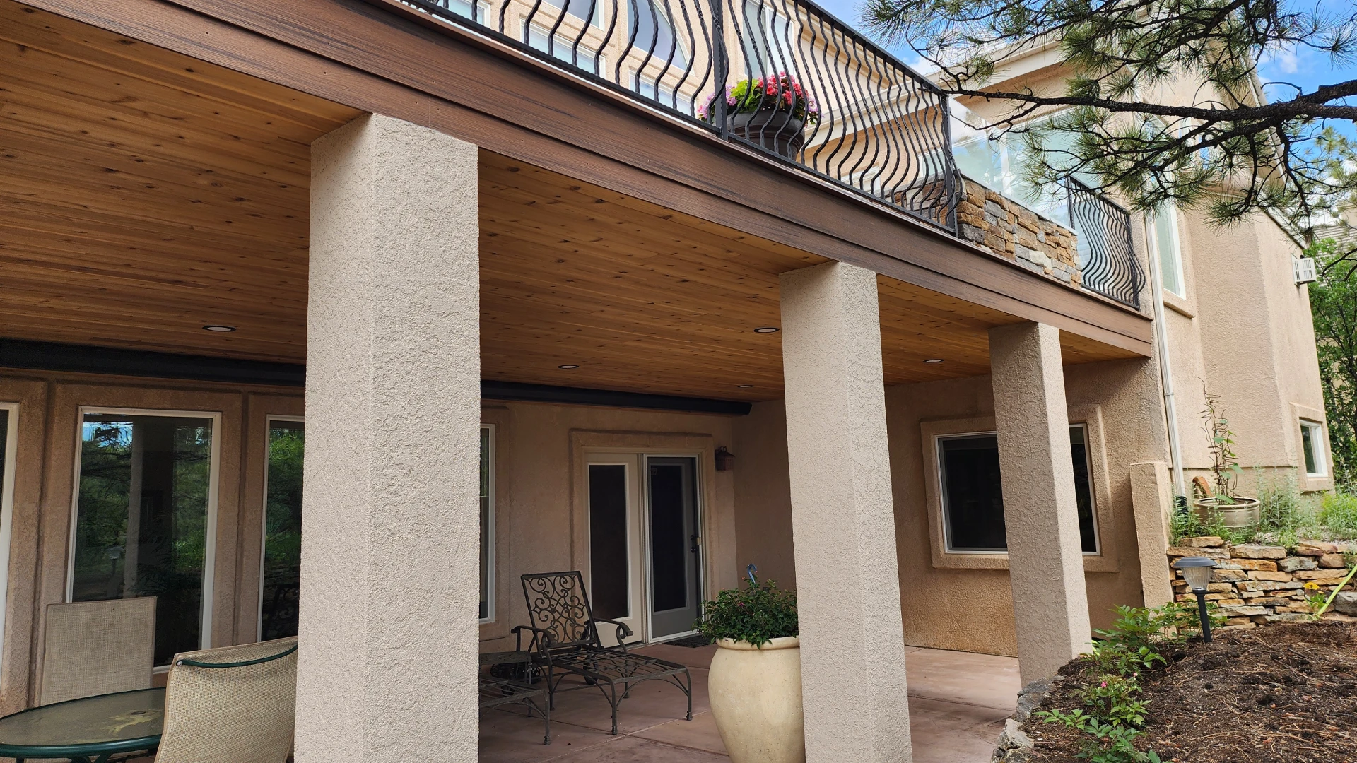 residential-under-deck-framing-with-multiple-windows-and-potted-plants-in-castle-rock-co.webp