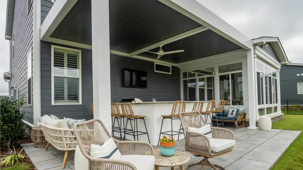 screened-in-porch-and-patio-with-outdoor-living-kitchen-and-a-tv-on-the-wall-in-castle-rock-co