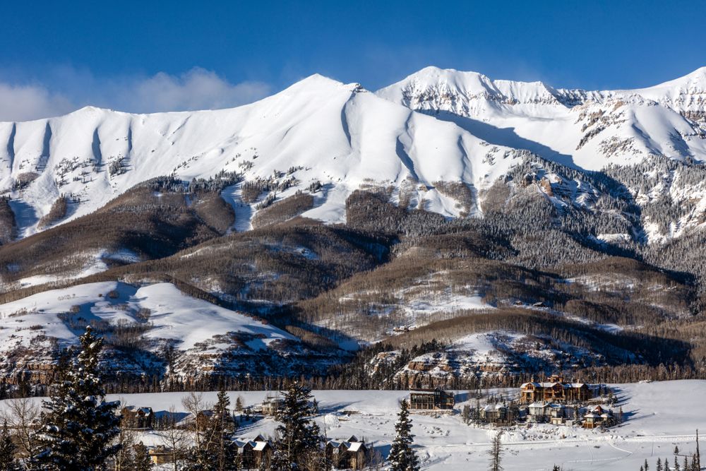 snow-covered-mountain-with-houses-on-the-bottom-in-castle-rock-co