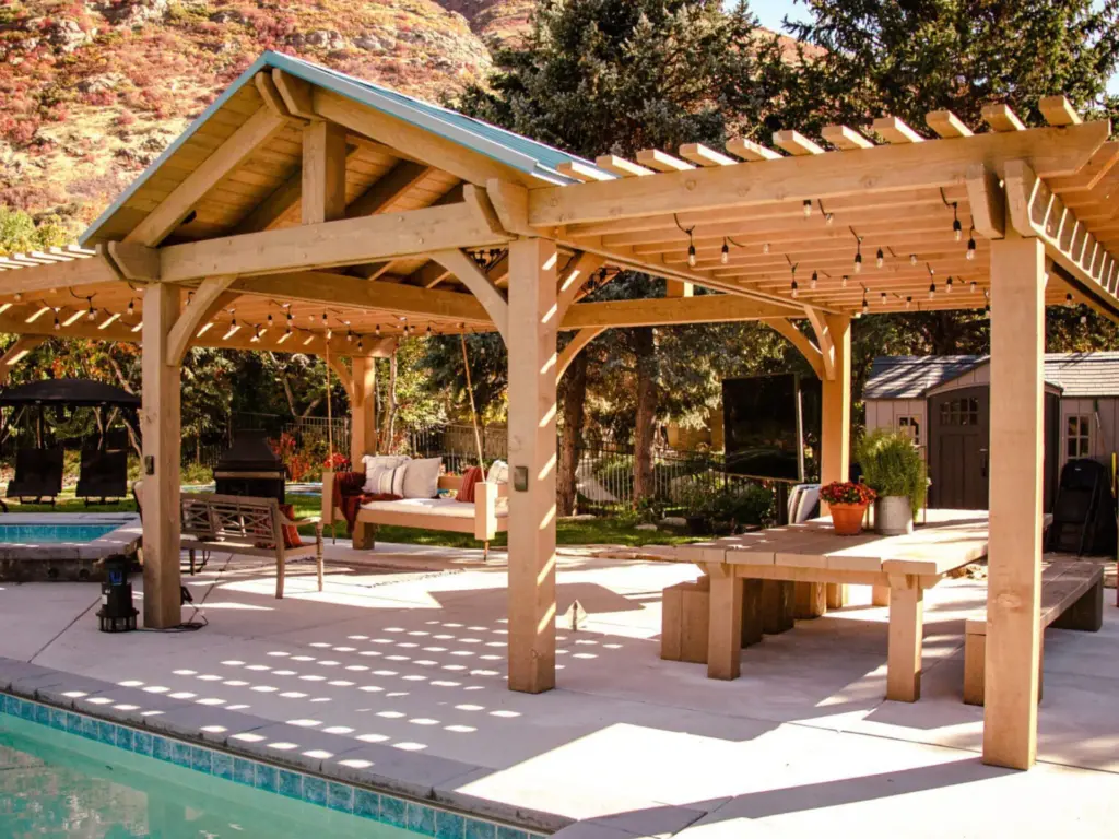 traditional-gazebo-with-outdoor-living-space-and-pool-surrounded-by-big-trees-on-the-background-in-castle-rock-co