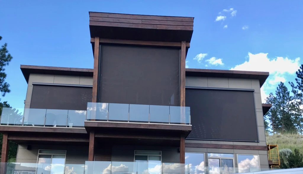 two-story-deck-installation-with-glass-railings-and-screened-in-porch-on-the-residential-house-in-castle-rock-co