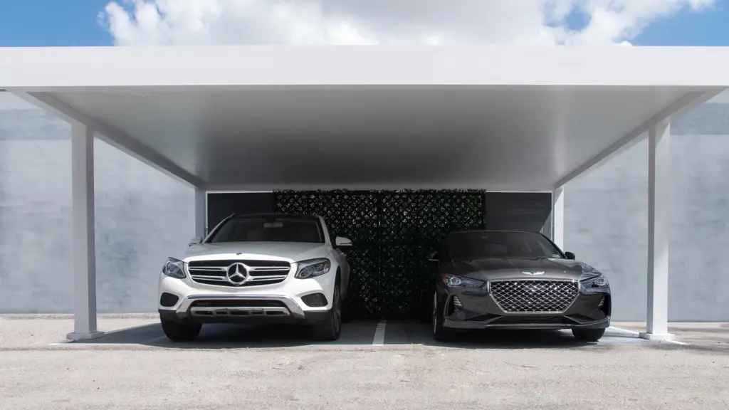 white-carport-with-black-and-white-luxury-cars-with-cloudy-sky-and-concrete-wall-on-the-background-in-castle-rock-co